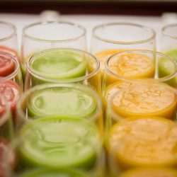 Vibrant selection of assorted fruit juices in glasses, showcasing variety and freshness.
